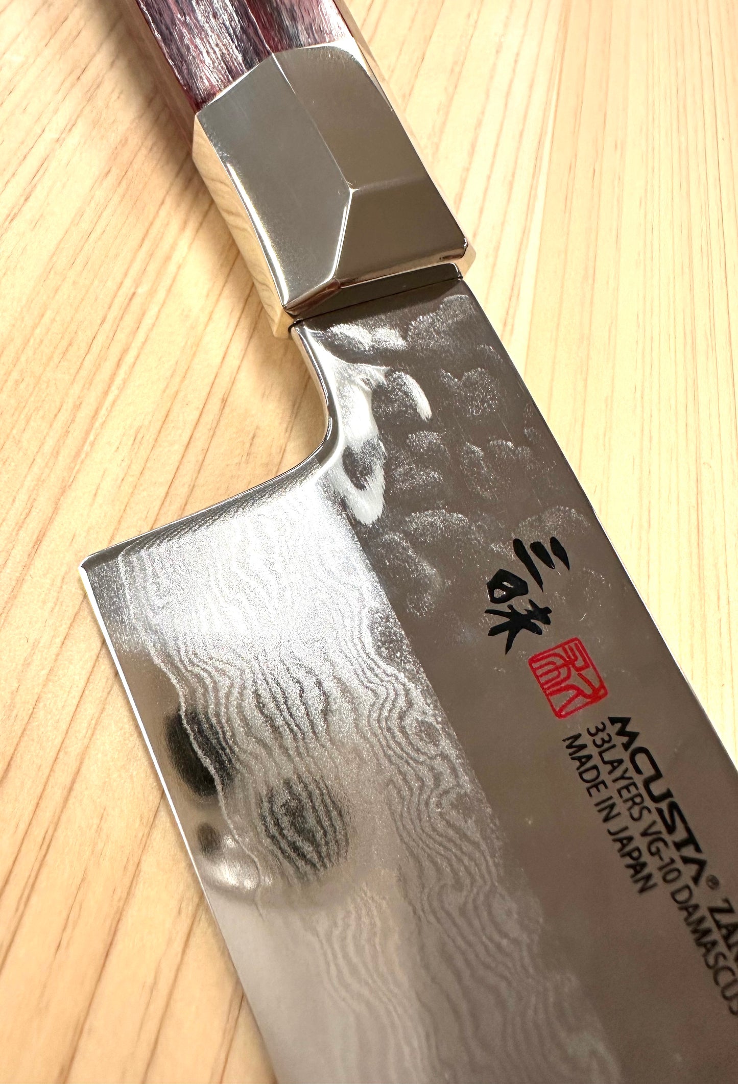 Santoku VG10 Supreme Hammered Mcusta 180mm SKU TZ2-4003dh